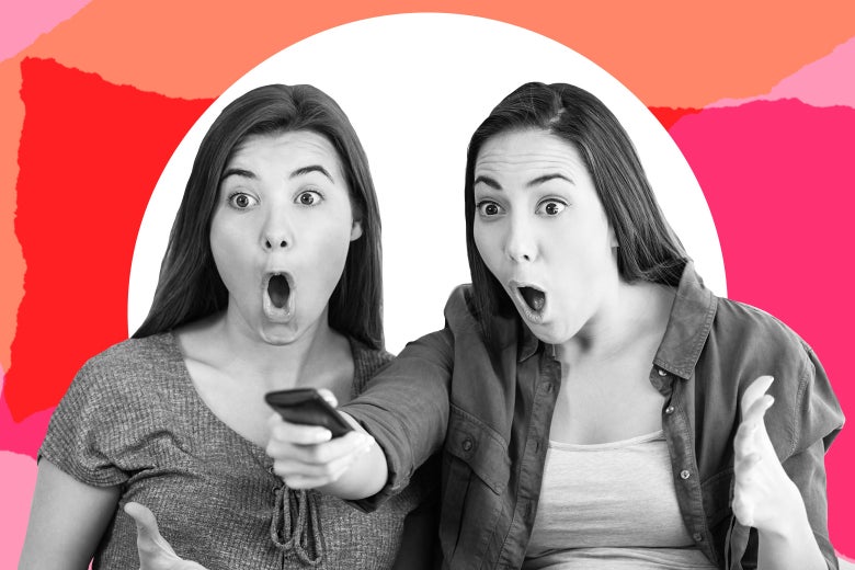 Two teen girls looking scandalized watching TV.
